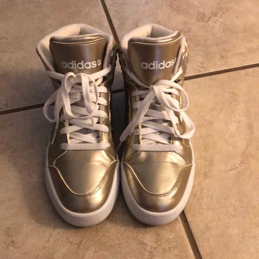 Gold and white adidas high top sneakers